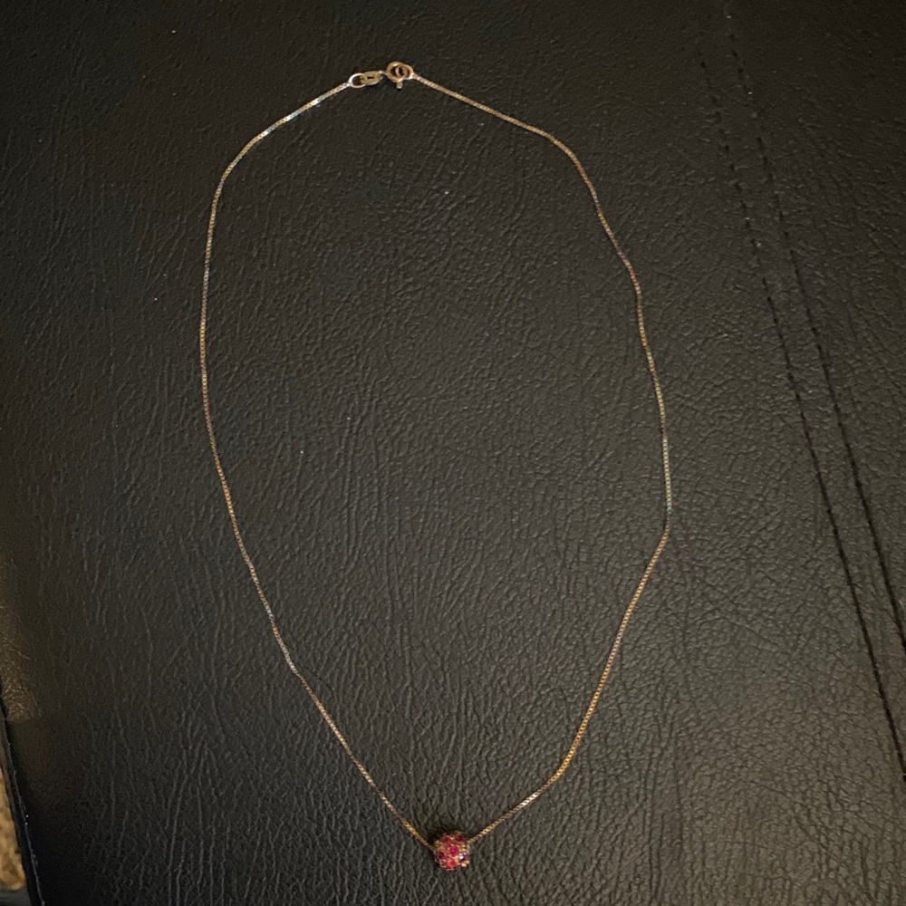 Elegant Gold Necklace with Red Pendant
